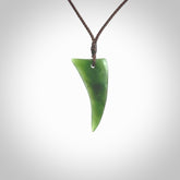 Hand carved pounamu drop pendant. Jade necklace hand made in New Zealand. A contemporary drop pendant carved from rare New Zealand jade. NZ Pacific jade jewellery for sale online.